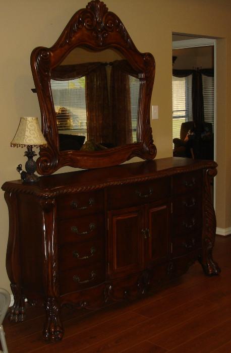 Ornately carved dresser with mirror