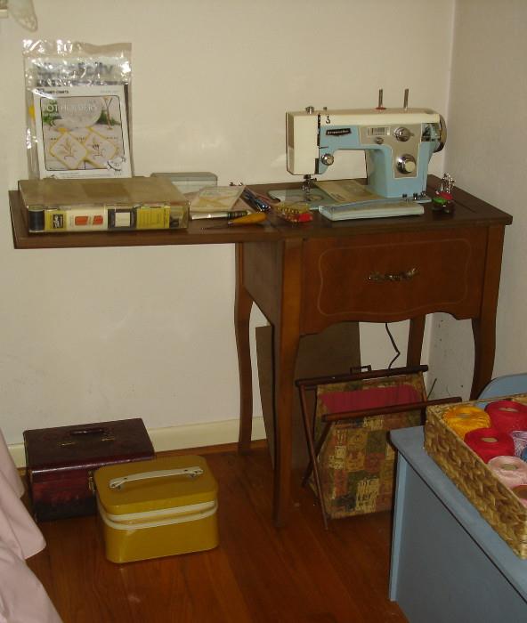 Sewing machine - Dressmaker brand with cabinet & contents