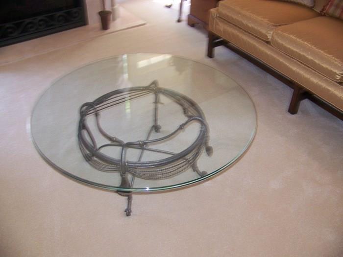 Round, glass and metal coffee table