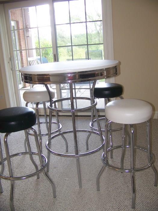 High, Chrome Table and 4 Leather and Chrome Stools