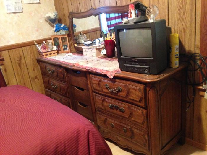 Dresser with mirror, and small TV.
