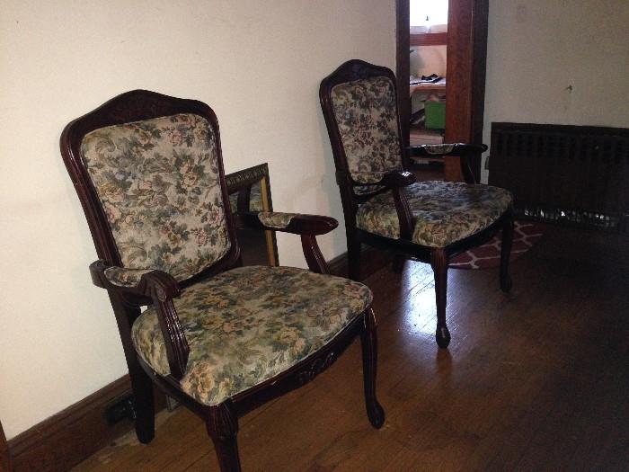 Tapestried Victorian-style chairs.