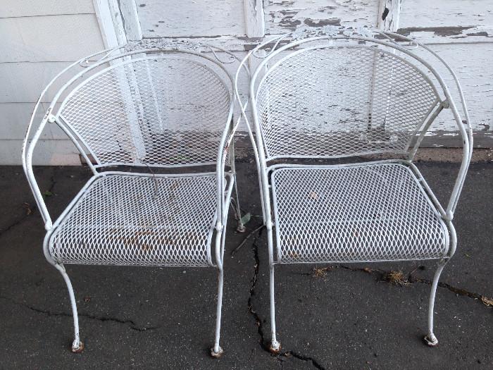 Part of a vintage white metal patio set. The chairs have a nice little flower detail on the top rail.