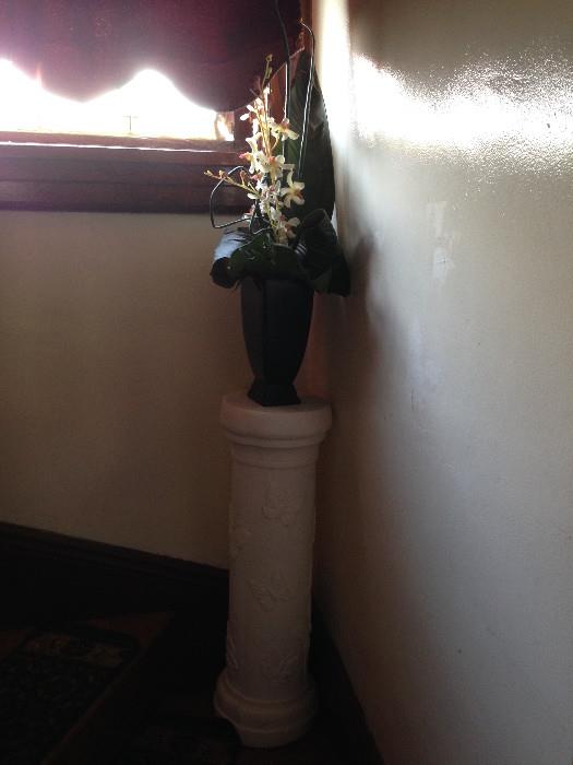 Pedestal and vase.