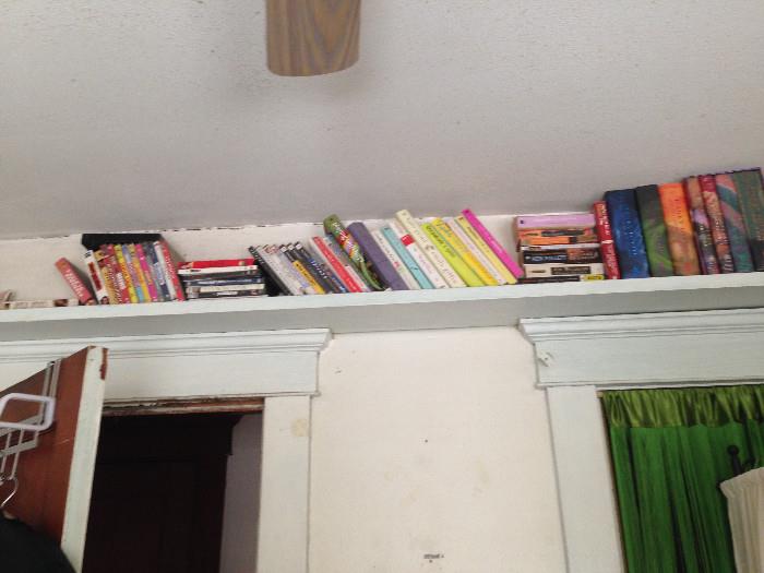 Lots of books -- bring a tall friend, this shelf is above the doorways.