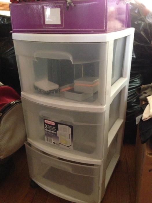 Three-drawer rolling storage unit.