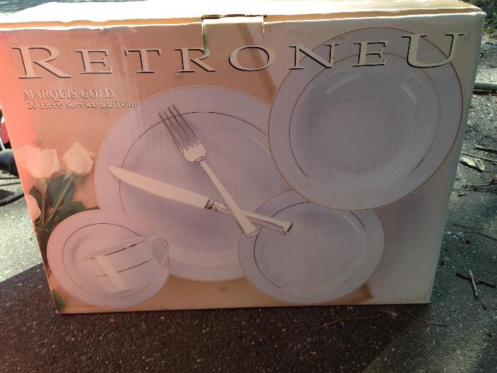 There are two of these Retroneu Marquis Gold service for four, new in box.