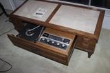 Pull out drawer with turntable and radio tuner.