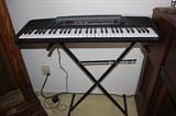 Electric keyboard with stand.