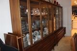 Two matching mid century china hutches with glass doors and drawers.
