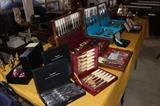 Stainless steel knife sets, multiple flatware sets.
