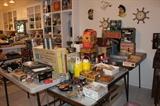 Vintage kitchen and entertaining items, most still in boxes. Heating trays and pressure cookers.