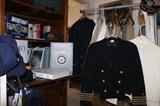 US Naval dress and standard issue uniforms, hats, books and memorabilia.