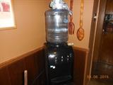 water dispenser with full bottle unopened water 