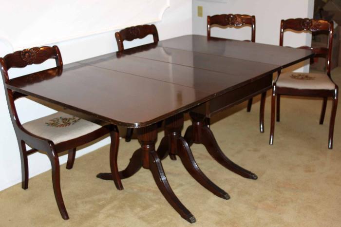 Beautiful dining room set with an expandable table and four detailed, tapestry chairs. The length of the table ranges from 23.5" when collapsed to 94" when fully extended with two additional leaves. Table pad included.