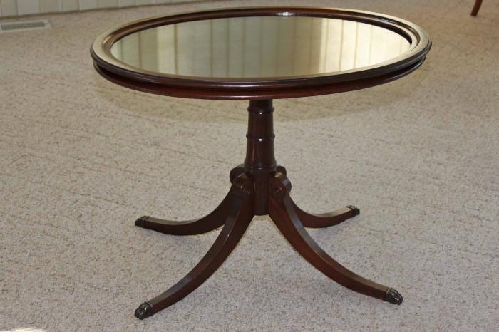 Small table that matches dining table has a removable glass top.