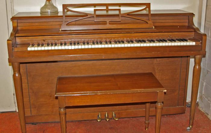 American Craftsman piano made for Winter & Co. Piano comes with bench and sheet music. Approximate dimensions are 58"L x 36"W x 37"H.