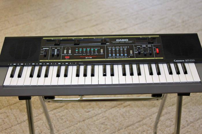 Casiotone MT.210 keyboard, with a removable stand and cover.