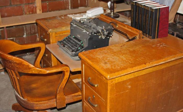 Solid Oak desk with typewriter revealed.