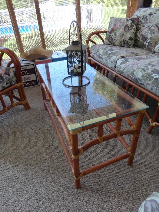 Tempered glass topped coffee table that matches bamboo porch set.