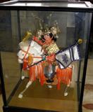 Asian Figurine under Glass