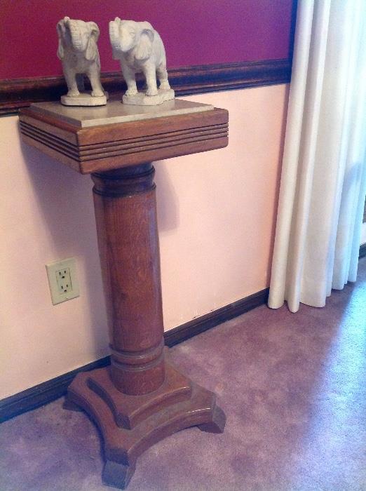 There is a pair of the oak marble top stands
