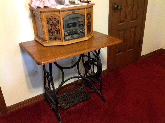 Cast iron sewing table.  Radio, phono, tape.