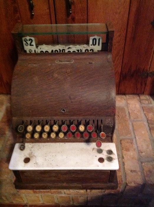 Antique cash register, National.  Metal wood grain