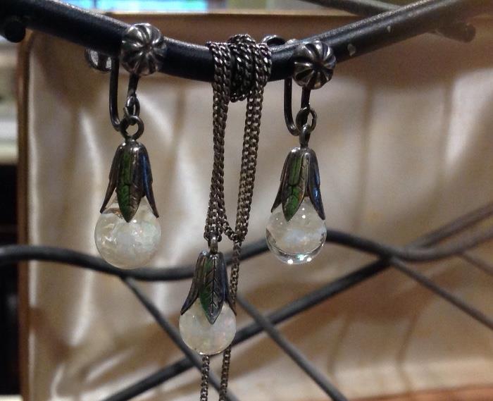 Set of Sterling screw back earrings and necklace.  Floating opals in glass teardrops.