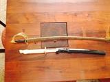Two real swords, one very old, both with authentic blades