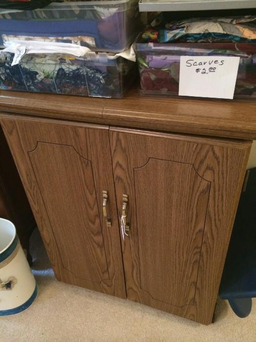 Large assortment of scarves; sewing machine in cabinet