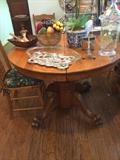 Antique oak table has 6 chairs & 2 leaves.