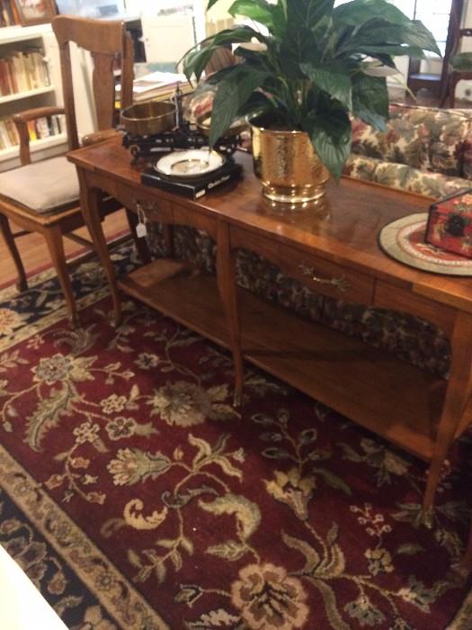 Sofa table; large rug; antique chair