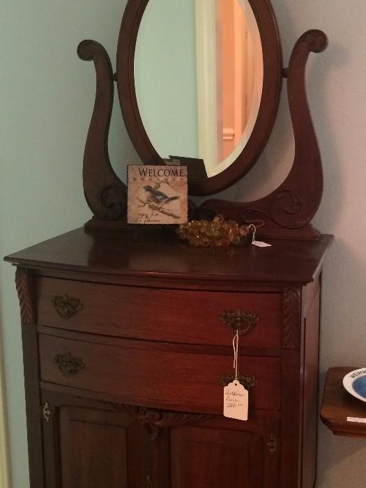 Antique upright gentleman's dresser 