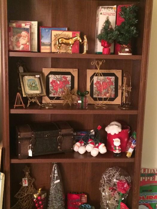 Book case filled with assorted Christmas items