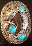 J. Delgarito sterling bolo tie with turquoise and animal claw.