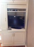 flat screen tv and cabinet