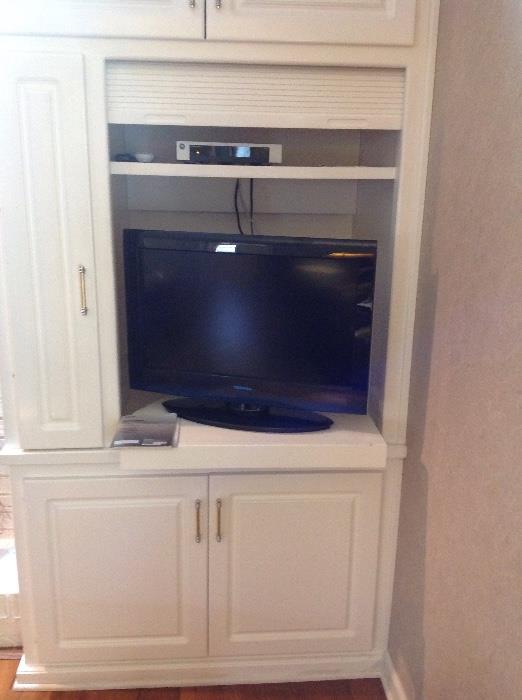 flat screen tv and cabinet