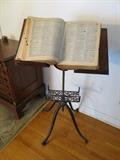 Late 19th century iron/wood book stand.  Articulates perfectly.