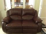 Brown leather reclining love seat.....