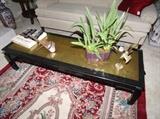 Gold leaf coffee table with custom glass cut to size. Hand made rug in great condition and a stereoscope to the left