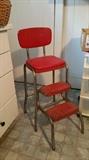 red fold up step stool