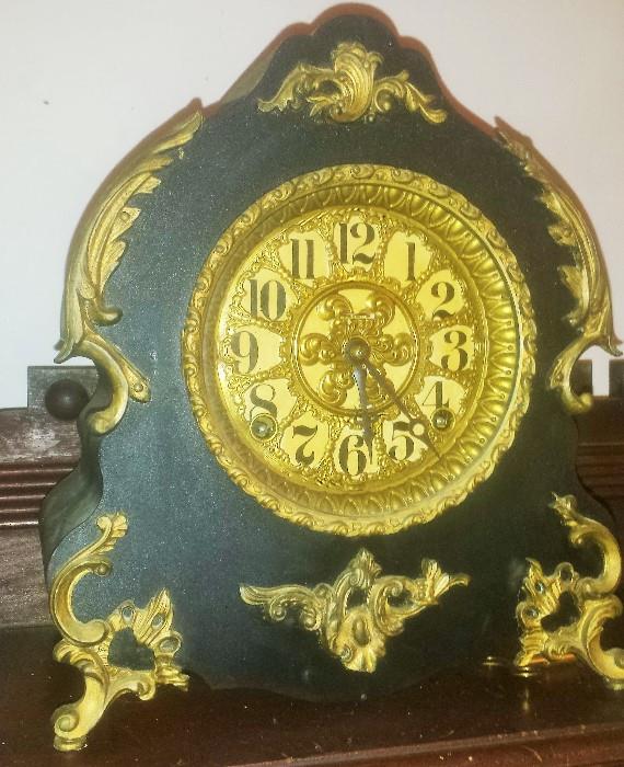 French mantle clock with ebonized wood & metal trim. It works! Key & pendulum included. 