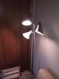 Brushed metal three light floor lamp with adjustable heads