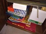 Vintage board games including pirate and traveler, wide world, uncle wiggly and pollyanna