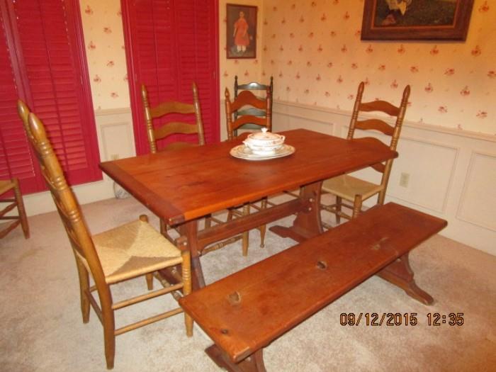 TABLE WITH FOUR CHAIRS AND BENCH.  2 ADDITIONAL CHAIRS AVAILABLE.