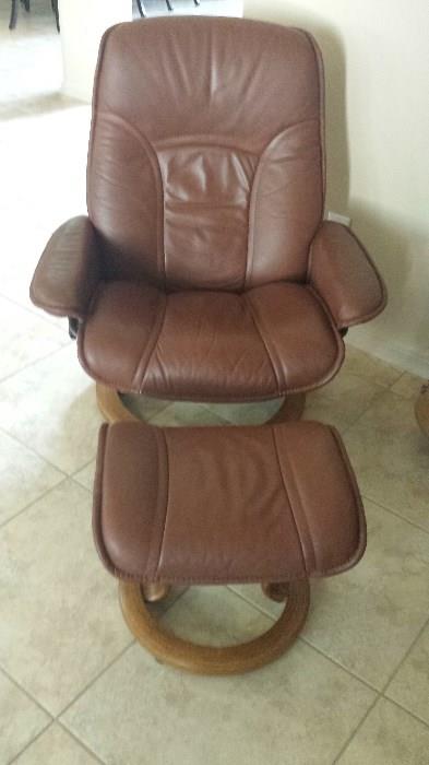 Scandinavian leather chair and foot stool. Excellent condition.  $200.00