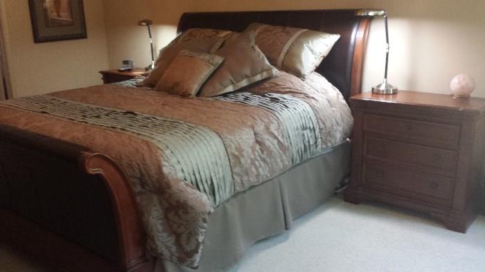 King Espresso leather sleigh bed.  Almost new Sealy hybrid mattress (inner spring with memory foam top) has been covered with waterproof/dust proof mattress pad since purchase. This set of King bed, mattress, 2 bedside tables, 9 drawer chest, bench, all for $1500.00! Comforter and pillows optional.  