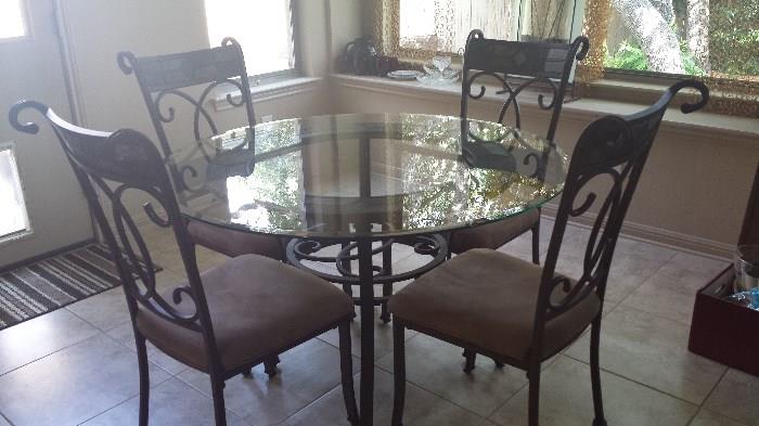 Glass top breakfast table with slate inserts in chairs.  Like new condition. $300.00