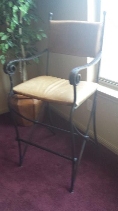 4 Heavy iron bar stools with leather seats and backs.  Perfect for the game room. $35.00 each or 4 for $100.00